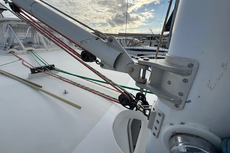  Yacht Photos Pics Sailboat rigging on 2009 Kelsall 58 KSS, featuring ropes and pulleys under a cloudy sky.