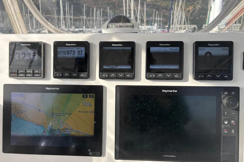  Yacht Photos Pics Kelsall 58 KSS 2009 yacht dashboard with Raymarine navigation displays and controls.