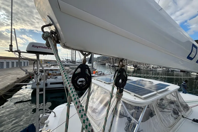  Yacht Photos Pics Sailboat Kelsall 58 KSS (2009) with solar panels docked at a marina.