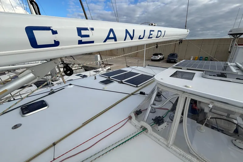  Yacht Photos Pics 2009 Kelsall 58 KSS catamaran with solar panels and rigging, docked under cloudy skies.