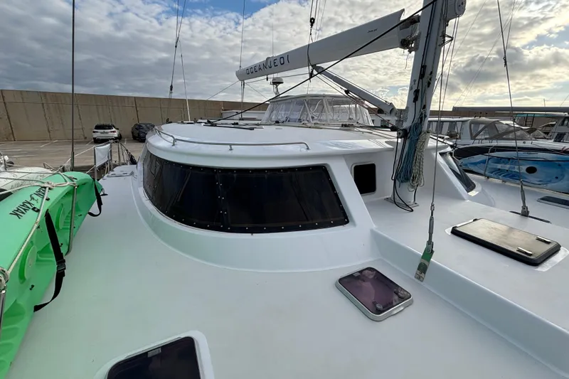  Yacht Photos Pics 2009 Kelsall 58 KSS catamaran docked, featuring sleek design and spacious deck.