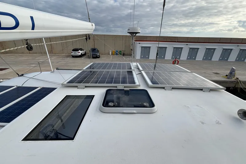  Yacht Photos Pics Kelsall 58 KSS 2009 yacht with solar panels on deck, docked at marina.