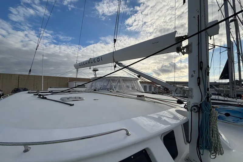  Yacht Photos Pics 2009 Kelsall 58 KSS catamaran deck with mast and rigging under cloudy sky.
