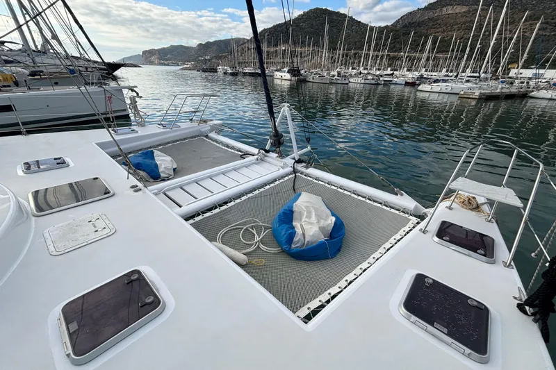  Yacht Photos Pics Kelsall 58 KSS catamaran, 2009 model, docked in a marina with scenic mountain backdrop.