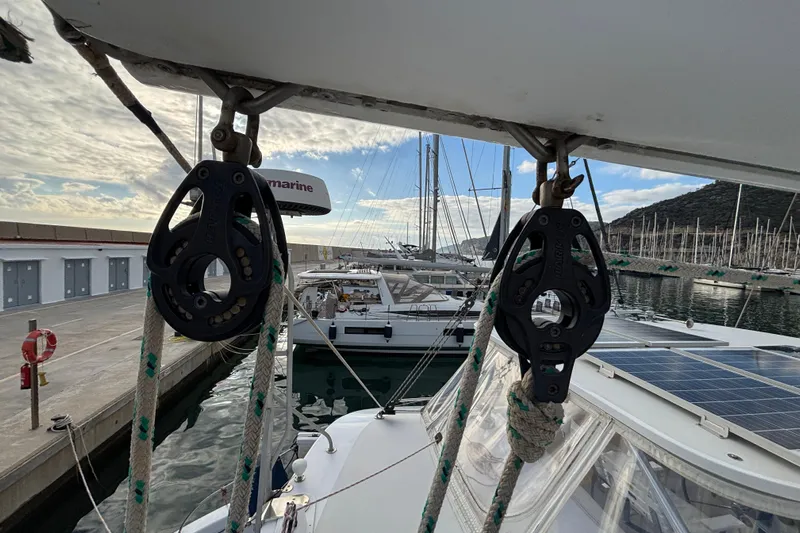  Yacht Photos Pics Kelsall 58 KSS 2009 yacht docked in marina, featuring rigging and solar panels.