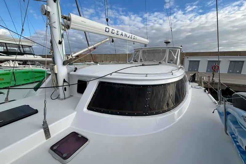  Yacht Photos Pics 2009 Kelsall 58 KSS catamaran docked, featuring sleek design and spacious deck.