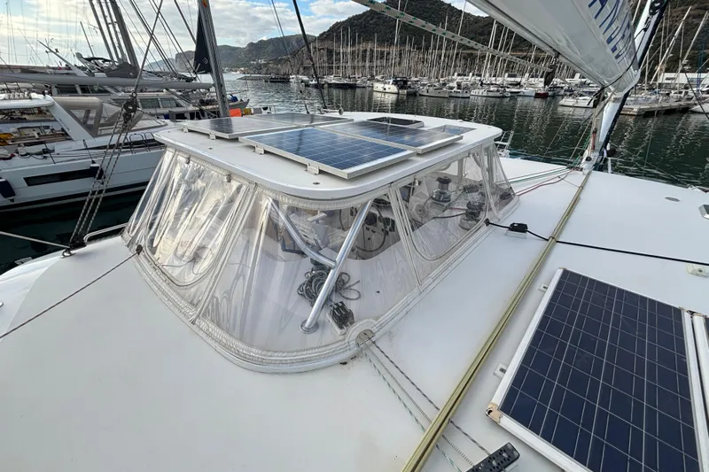  Yacht Photos Pics Sailboat Kelsall 58 KSS 2009 with solar panels docked in a marina.