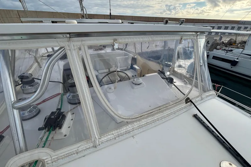  Yacht Photos Pics 2009 Kelsall 58 KSS yacht cockpit with clear enclosure and steering wheel.