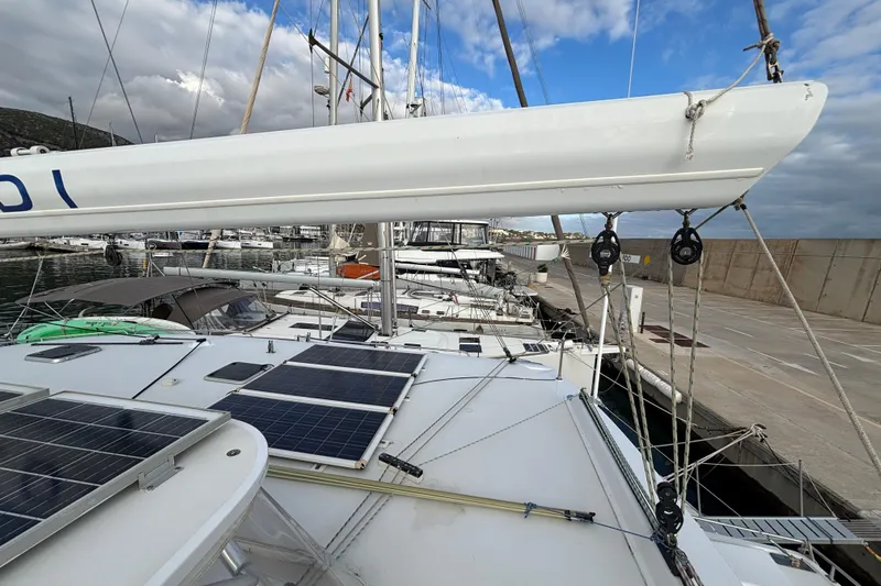 Yacht Photos Pics Sailboat docked at marina, featuring solar panels on deck, Kelsall 58 KSS, 2009 model.