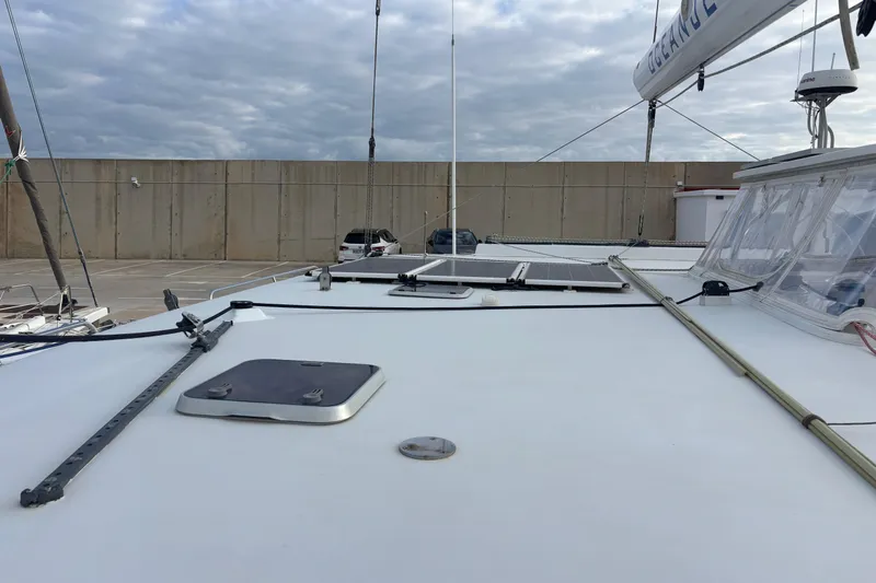  Yacht Photos Pics 2009 Kelsall 58 KSS yacht deck with solar panels and clear sky.