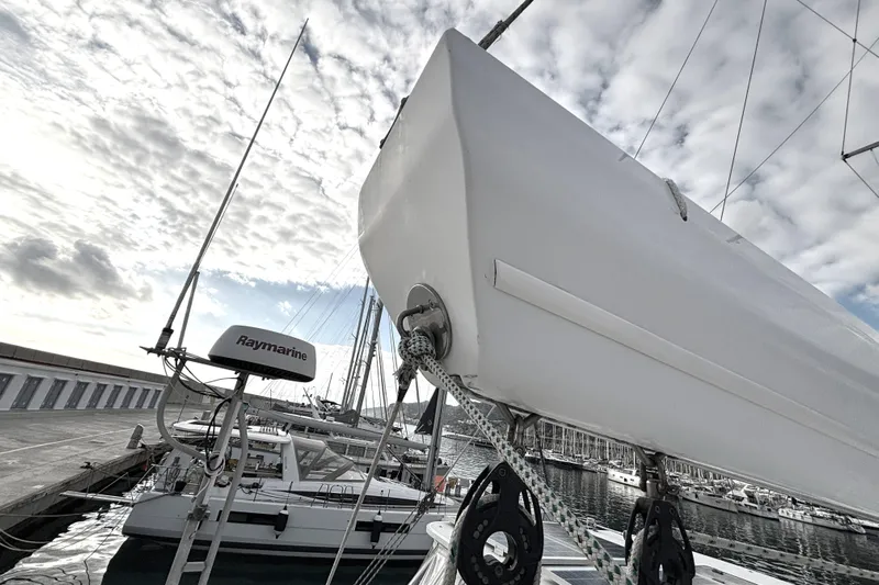  Yacht Photos Pics Sailboat Kelsall 58 KSS (2009) docked at marina under cloudy sky.
