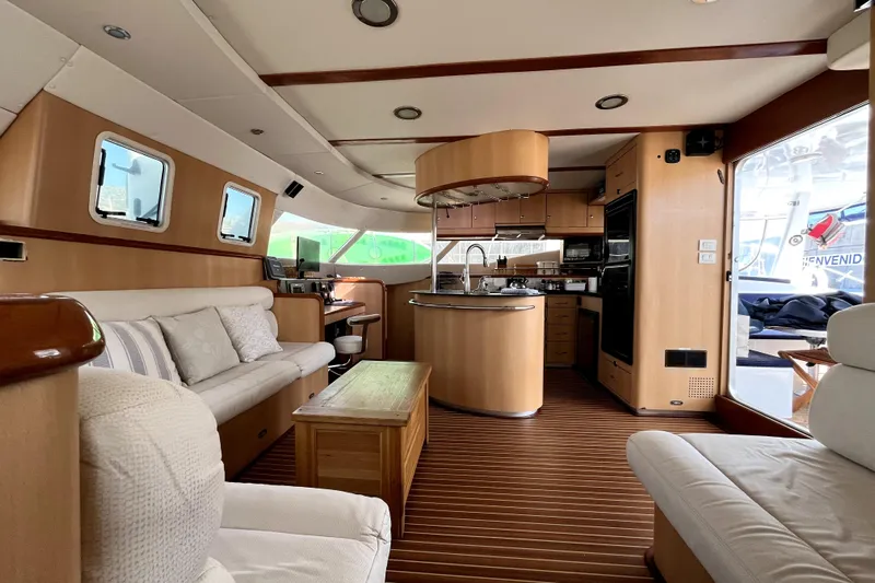  Yacht Photos Pics Luxurious interior of 2009 Kelsall 58 KSS yacht with modern kitchen and seating area.