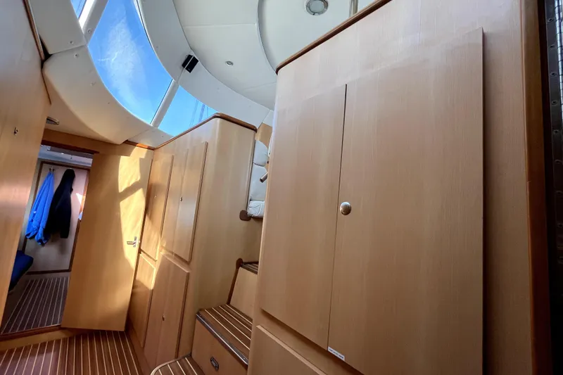  Yacht Photos Pics Interior of 2009 Kelsall 58 KSS yacht with wooden cabinetry and skylight.