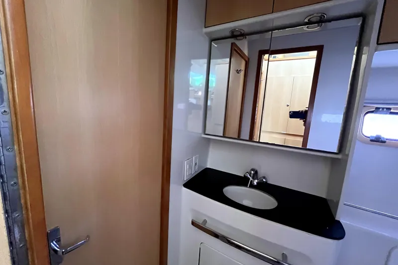  Yacht Photos Pics Compact bathroom in 2009 Kelsall 58 KSS yacht with mirror and sink.