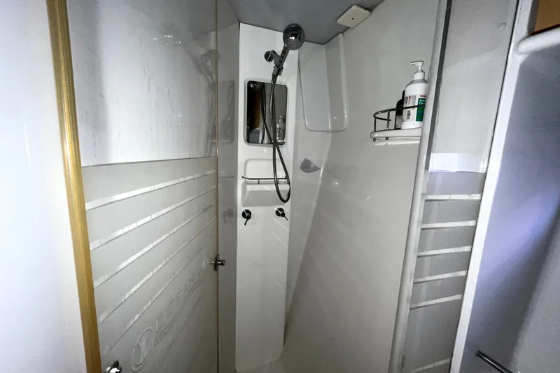  Yacht Photos Pics Shower area in 2009 Kelsall 58 KSS yacht, featuring modern fixtures and storage.