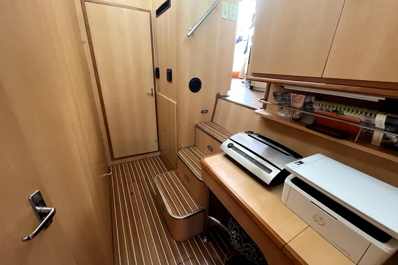  Yacht Photos Pics Interior of 2009 Kelsall 58 KSS yacht with wooden flooring and office equipment.
