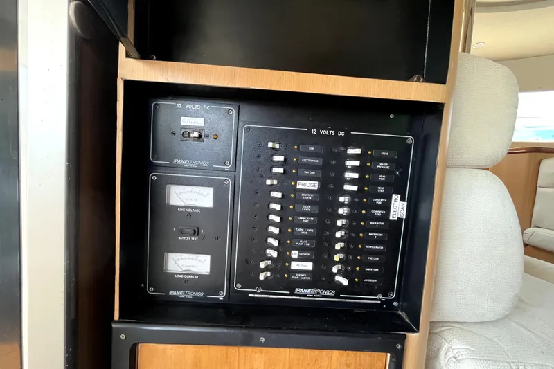  Yacht Photos Pics Electrical panel on 2009 Kelsall 58 KSS yacht, featuring 12 volts DC controls.