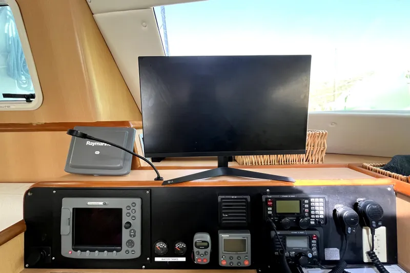  Yacht Photos Pics Control panel of 2009 Kelsall 58 KSS yacht with navigation and communication equipment.