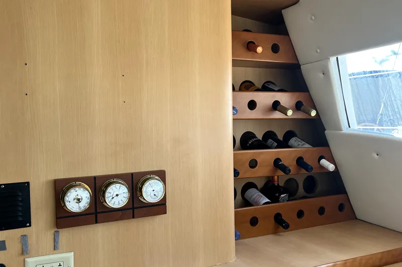  Yacht Photos Pics Interior of 2009 Kelsall 58 KSS yacht with wine rack and nautical instruments.