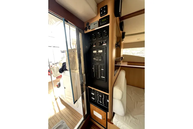  Yacht Photos Pics Control panel inside 2009 Kelsall 58 KSS yacht, featuring modern navigation and electrical systems.