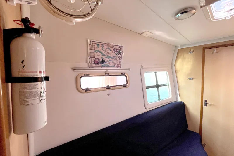  Yacht Photos Pics Interior of 2009 Kelsall 58 KSS boat with fire extinguisher and windows.