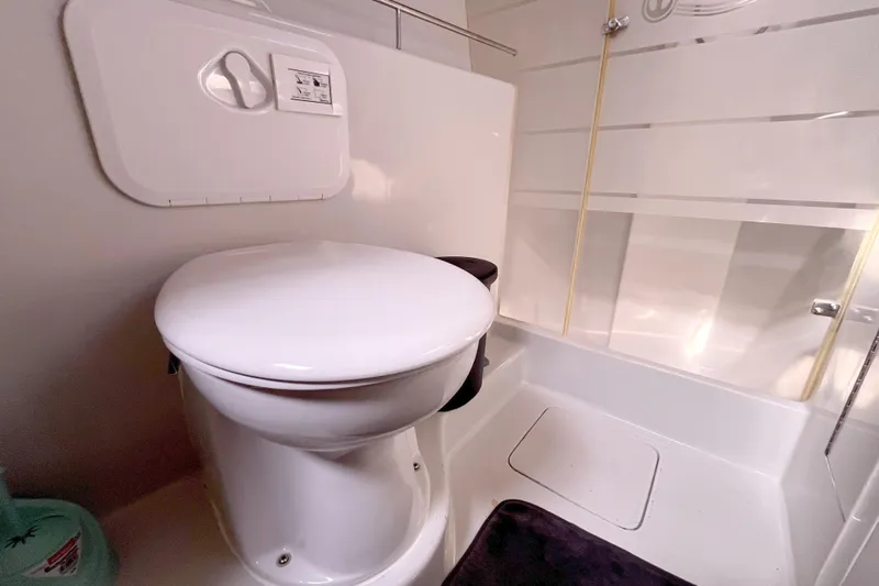  Yacht Photos Pics Compact bathroom in 2009 Kelsall 58 KSS yacht with toilet and shower area.