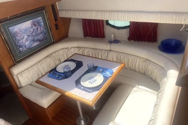 Gloryb2god Yacht Photos Pics Luxurious 1990 Carver 55 yacht interior with elegant dining area and nautical decor.