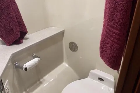 Gloryb2god Yacht Photos Pics Bathroom interior of a 1990 Carver 55 yacht with maroon towels.