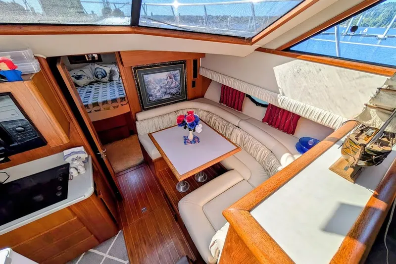 Gloryb2god Yacht Photos Pics Luxurious interior of a 1990 Carver 55 yacht with elegant seating and decor.