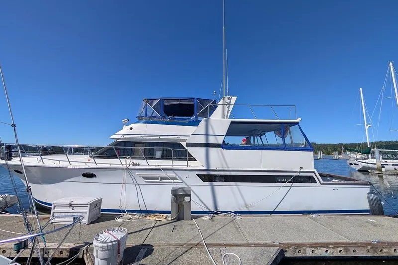 Gloryb2god Yacht Photos Pics 1990 Carver 55 yacht docked at marina under clear blue sky.
