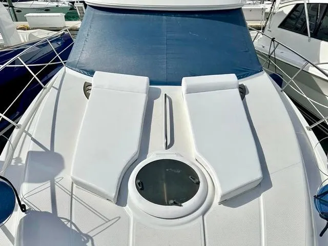  Yacht Photos Pics 2009 Meridian 391 Sedan yacht deck with sun loungers and circular hatch.