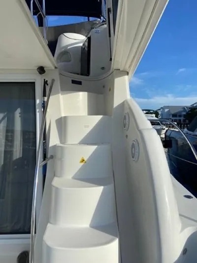  Yacht Photos Pics Staircase on 2009 Meridian 391 Sedan yacht under clear blue sky.