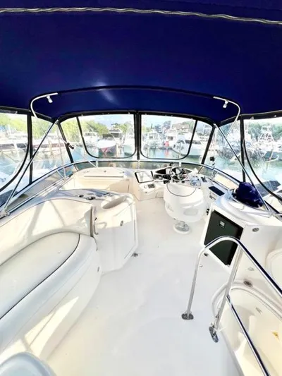  Yacht Photos Pics 2009 Meridian 391 Sedan yacht interior with blue canopy and white seating.