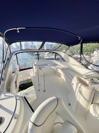  Yacht Photos Pics 2009 Meridian 391 Sedan yacht interior with white seating and blue canopy.