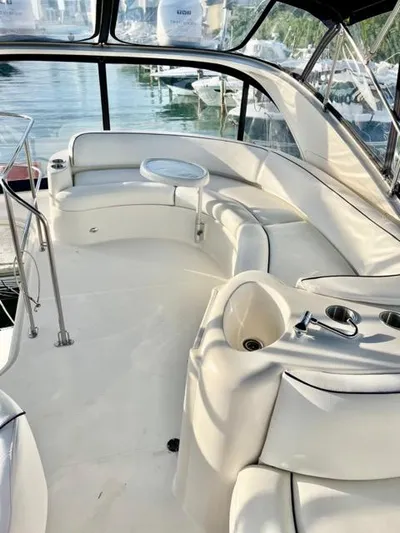  Yacht Photos Pics Luxurious 2009 Meridian 391 Sedan yacht interior with plush seating and panoramic windows.