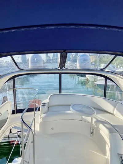  Yacht Photos Pics 2009 Meridian 391 Sedan yacht interior with seating and table, overlooking marina.