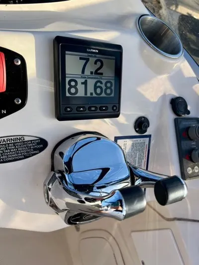  Yacht Photos Pics Close-up of 2009 Meridian 391 Sedan boat controls with Garmin display.