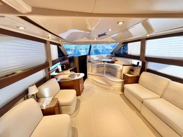  Yacht Photos Pics Luxurious interior of 2009 Meridian 391 Sedan yacht with elegant seating and panoramic windows.