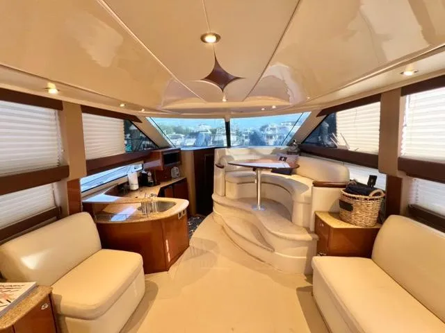  Yacht Photos Pics Luxurious interior of 2009 Meridian 391 Sedan yacht with elegant seating and panoramic windows.