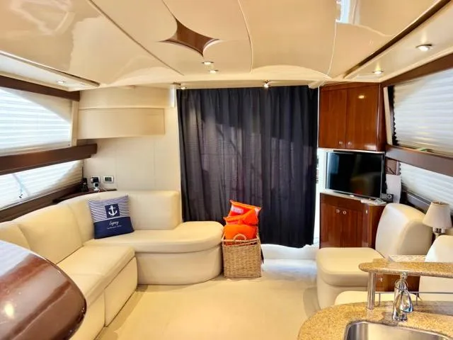  Yacht Photos Pics Luxurious interior of 2009 Meridian 391 Sedan yacht with plush seating and modern amenities.