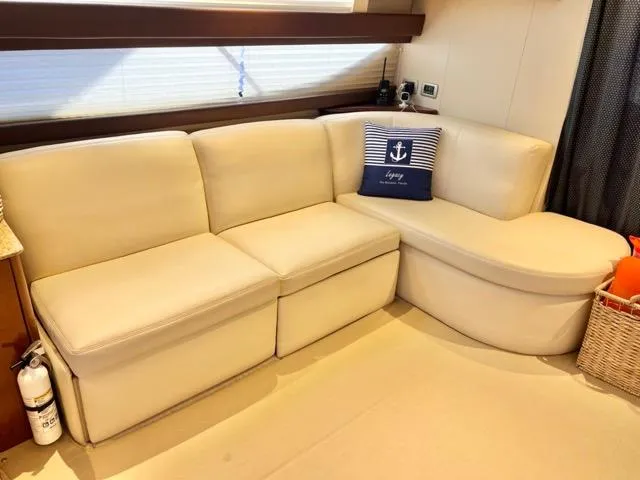  Yacht Photos Pics Luxurious interior of 2009 Meridian 391 Sedan with cream sofa and nautical decor.