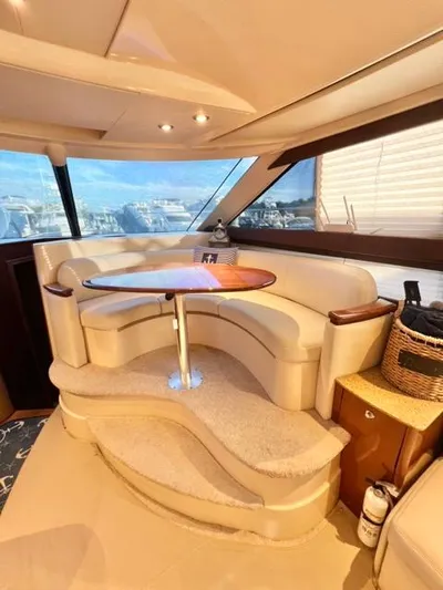  Yacht Photos Pics Interior of 2009 Meridian 391 Sedan yacht with elegant seating and table.