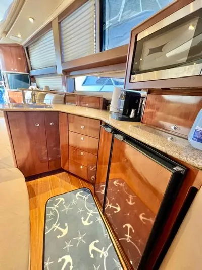  Yacht Photos Pics Luxurious 2009 Meridian 391 Sedan yacht interior with modern kitchen amenities.