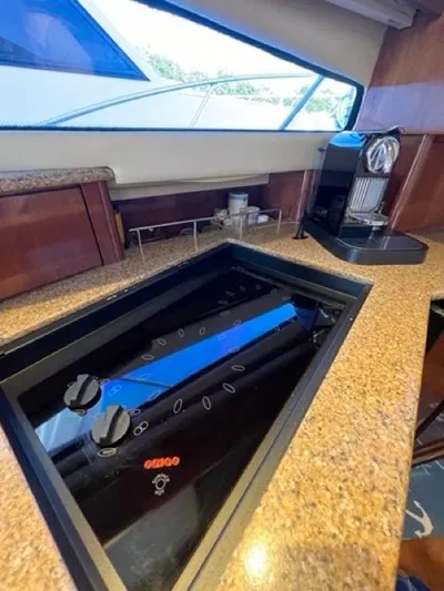  Yacht Photos Pics 2009 Meridian 391 Sedan yacht kitchen with stovetop and coffee maker.