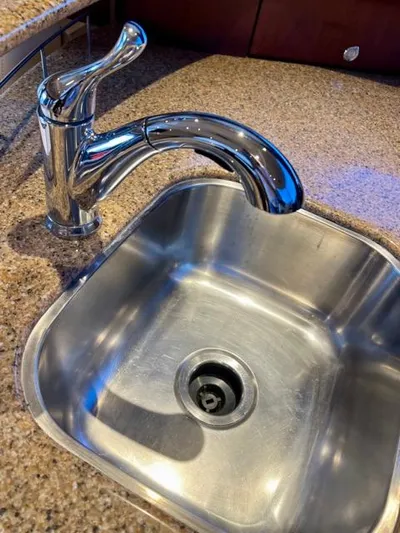  Yacht Photos Pics Stainless steel sink and faucet in 2009 Meridian 391 Sedan yacht kitchen.