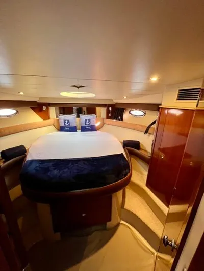  Yacht Photos Pics Luxurious 2009 Meridian 391 Sedan yacht bedroom interior with elegant wood finishes.