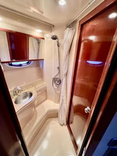  Yacht Photos Pics Luxurious bathroom in 2009 Meridian 391 Sedan yacht with shower and sink.
