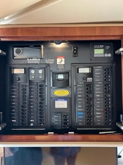  Yacht Photos Pics Electrical panel of a 2009 Meridian 391 Sedan yacht, featuring various switches and controls.