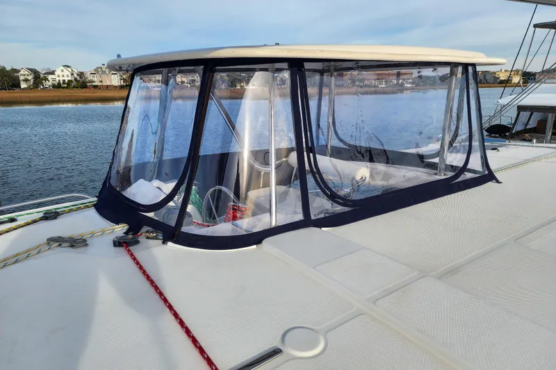 Playtime Yacht Photos Pics 2016 Leopard 44 Owners Version catamaran with clear cockpit enclosure on calm water.