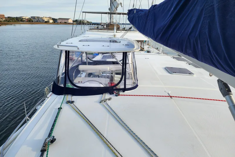 Playtime Yacht Photos Pics 2016 Leopard 44 Owners Version catamaran on calm water, showcasing deck and sail details.